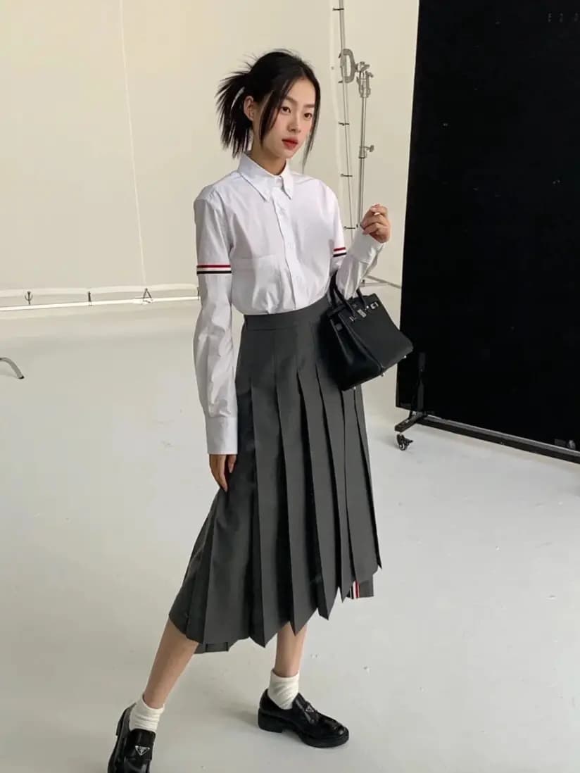 톰브라운 톰브라운 드롭 백 플리츠 미디 스커트 상세 이미지